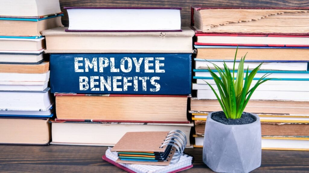 A book that says Employee Benefits is displayed.
